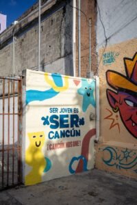 A wall that has some graffiti on it